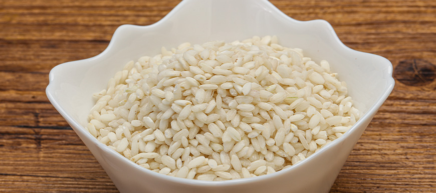 Arborio rice in a white bowl